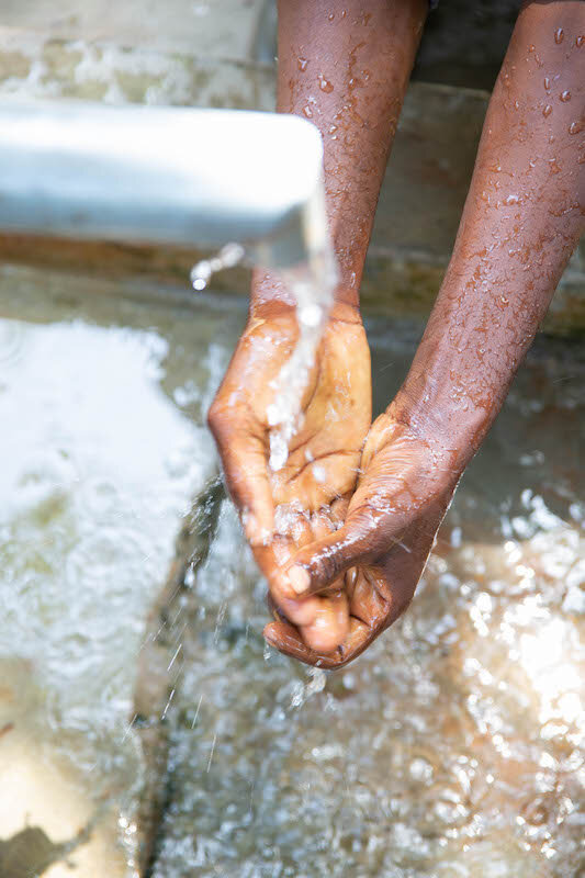 hands under running water